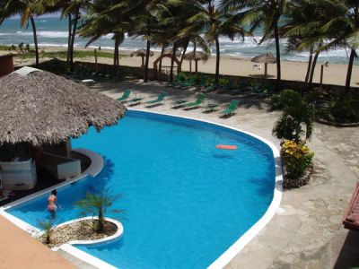 CARIBBEAN BEACHFRONT CONDO JUNE, JULY, AUGUST ONLY $1000 PER MONTH !!